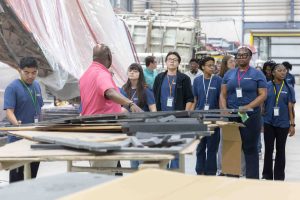Each year, VISIONS welcomes a new group of students to the program by introducing them to local career and educational opportunities. During the Summer Institute, students tour Greenville’s Grady-White Boats manufacturing facility, learning about the company and the careers involved in building boats. Company owner Eddie Smith is the VISIONS program’s benefactor.